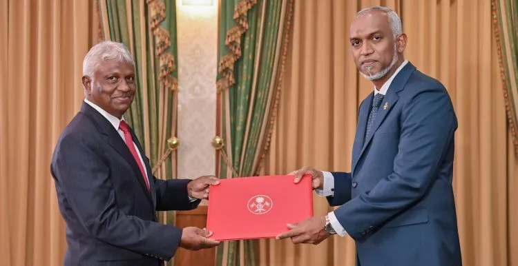 Presentation of letter of appointment to Fahmee-- Photo:President's Office