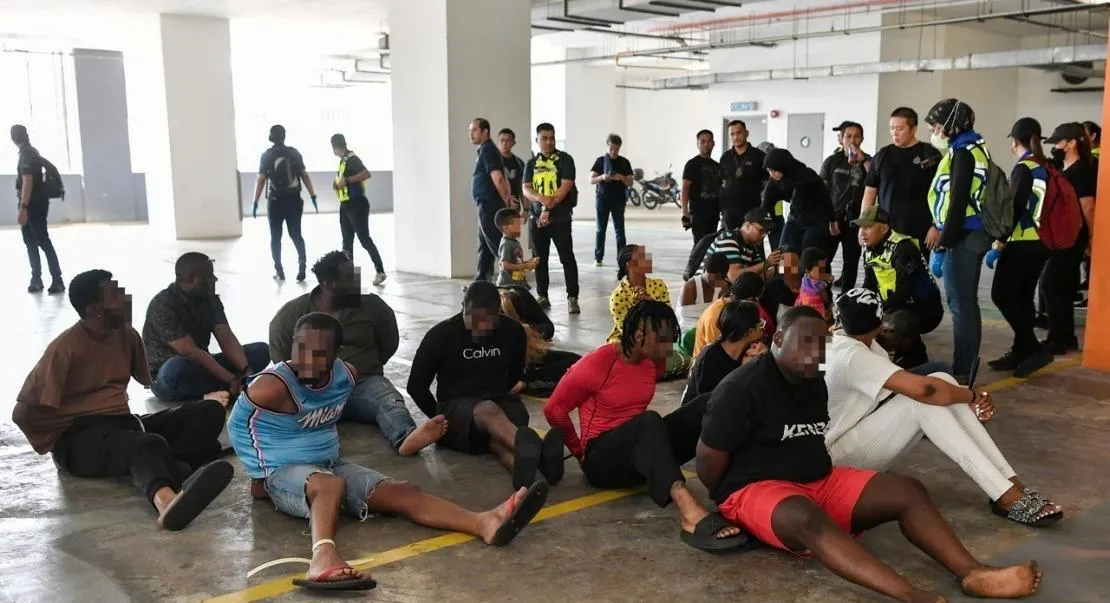 The foreigners detained in the anti- trafficking operation (Photo/Bernama news)