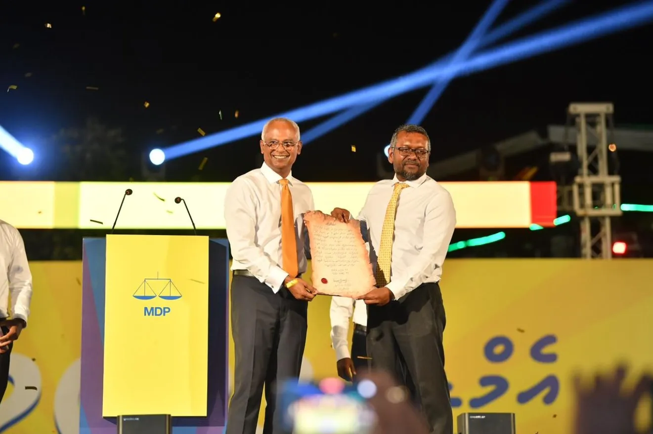 President Solih receiving the party ticket---picture: voice