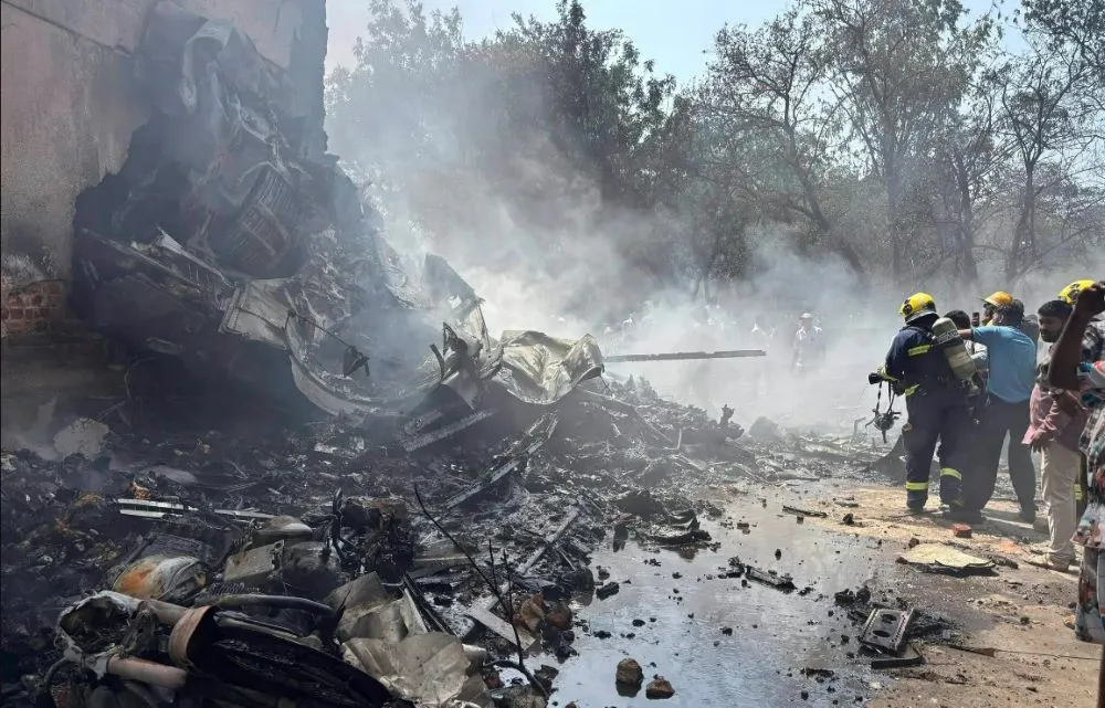 Firefighters at the site of an airplane crash in Ahmedabad, India, on Thursday (Photo/Ajit Solanki/Associated Press/ Via NYT)