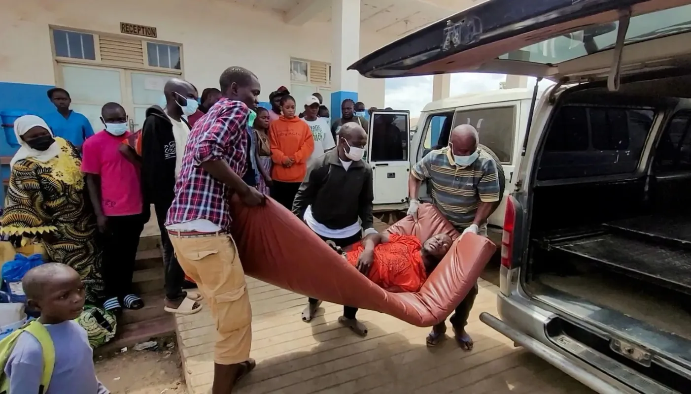 Man being taken for treatment of Ebola (Photo/Victoire Mukenge,Reuters)