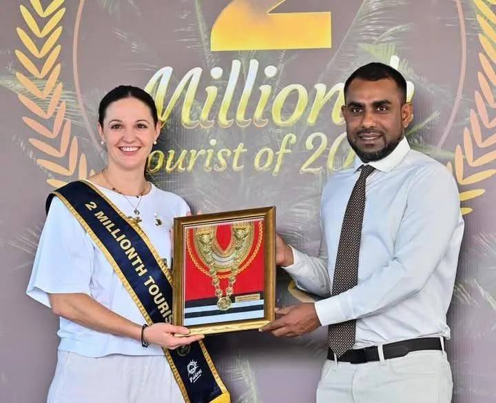 Astrid Dirnegger, two millionth tourist in 2024 and Tourism Minister Ibrahim Faisal (Photo/Minister Faisal via X)