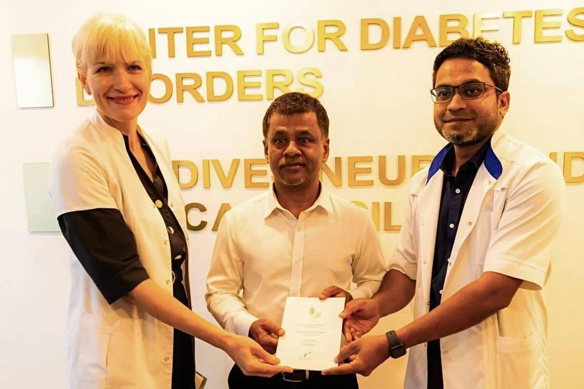 Dr. Mohamed Wisham (Right), Minister of Health Abdulla Nazim Ibrahim (middle), Dr. Mariya Rusalenko (left) during the book launch