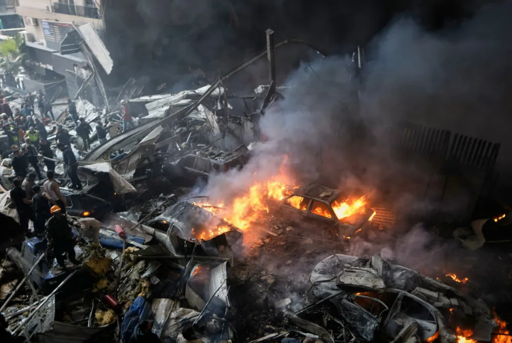 First responders work at the site of an israeli airstrike that struck an apartment building in Beirut, Lebanon on Wednesday
(AP Photo/Bilal Hussain)