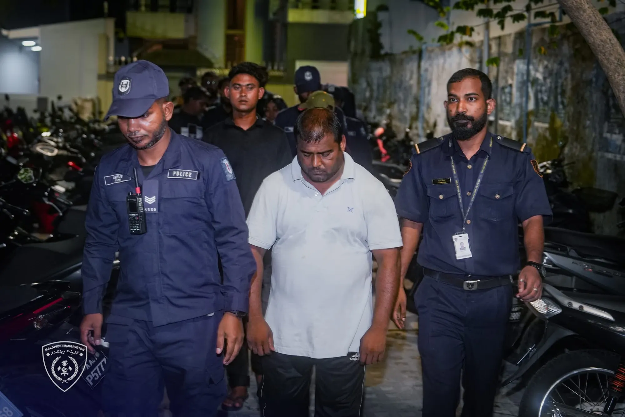 Illegal immigrant being arrested by Immigration officers (Photo/Immigration)